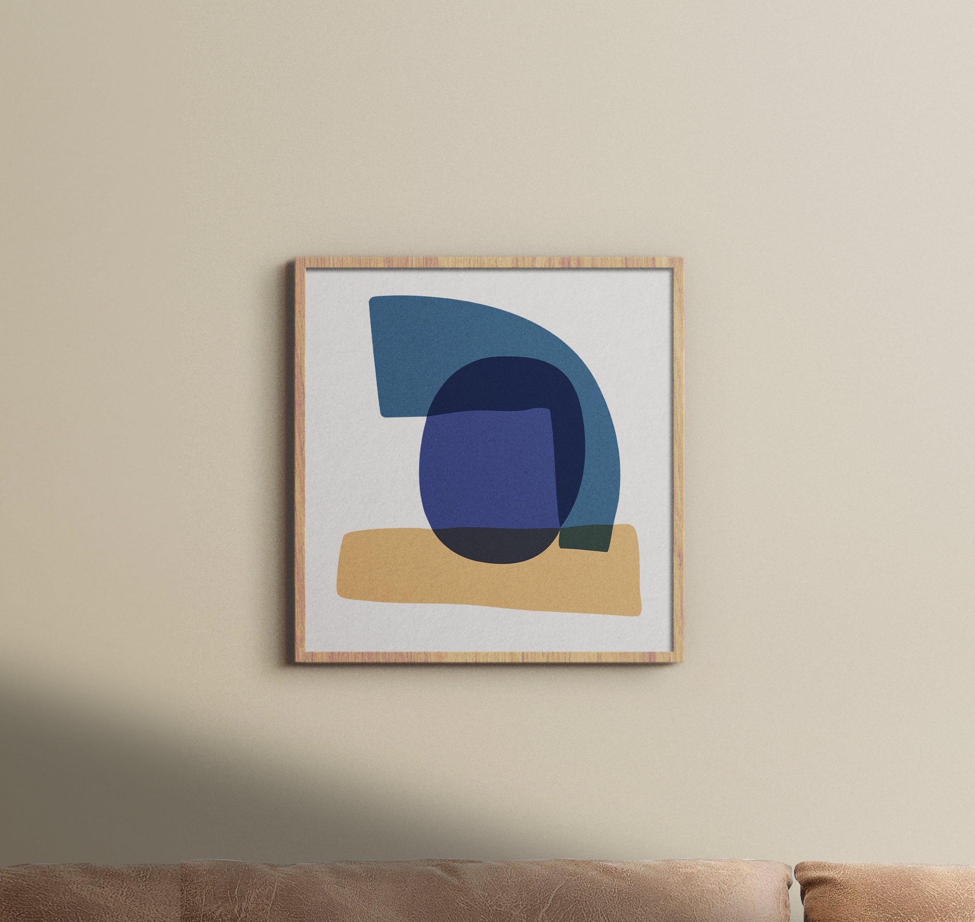 A Study in Blue I luxury modern abstract art print – museum-quality framed artwork for contemporary interiors. Shown as a framed print hanging on a light beige wall above brown couch.