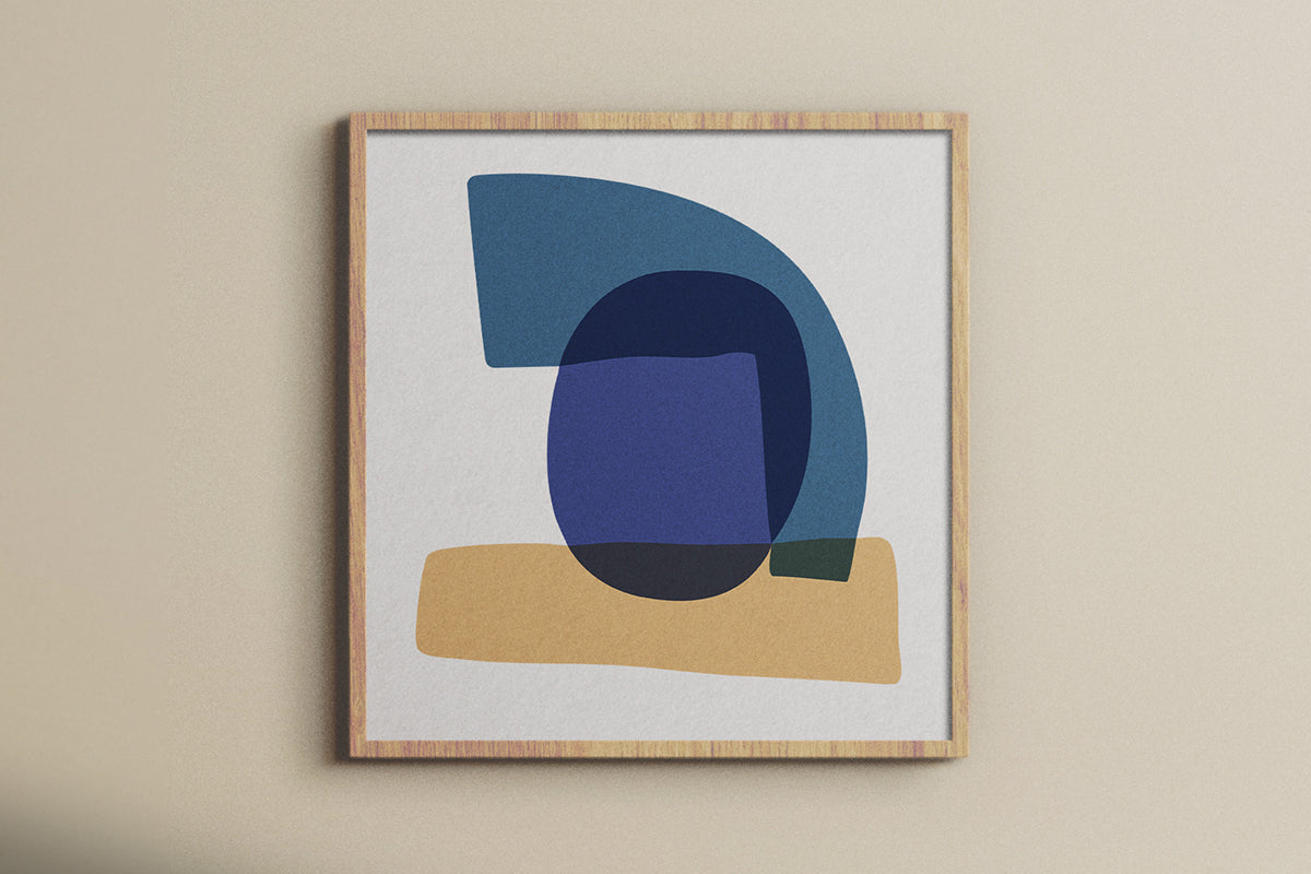 A Study in Blue I luxury modern abstract art print – museum-quality framed artwork for contemporary interiors. Shown as a framed print hanging on a light beige wall above brown couch.