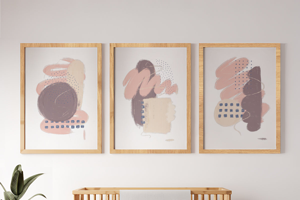 A Study in Pink triptych framed fine art print set, featuring delicate pink hues and organic forms, printed on museum-quality paper and framed in white, ready to hang.