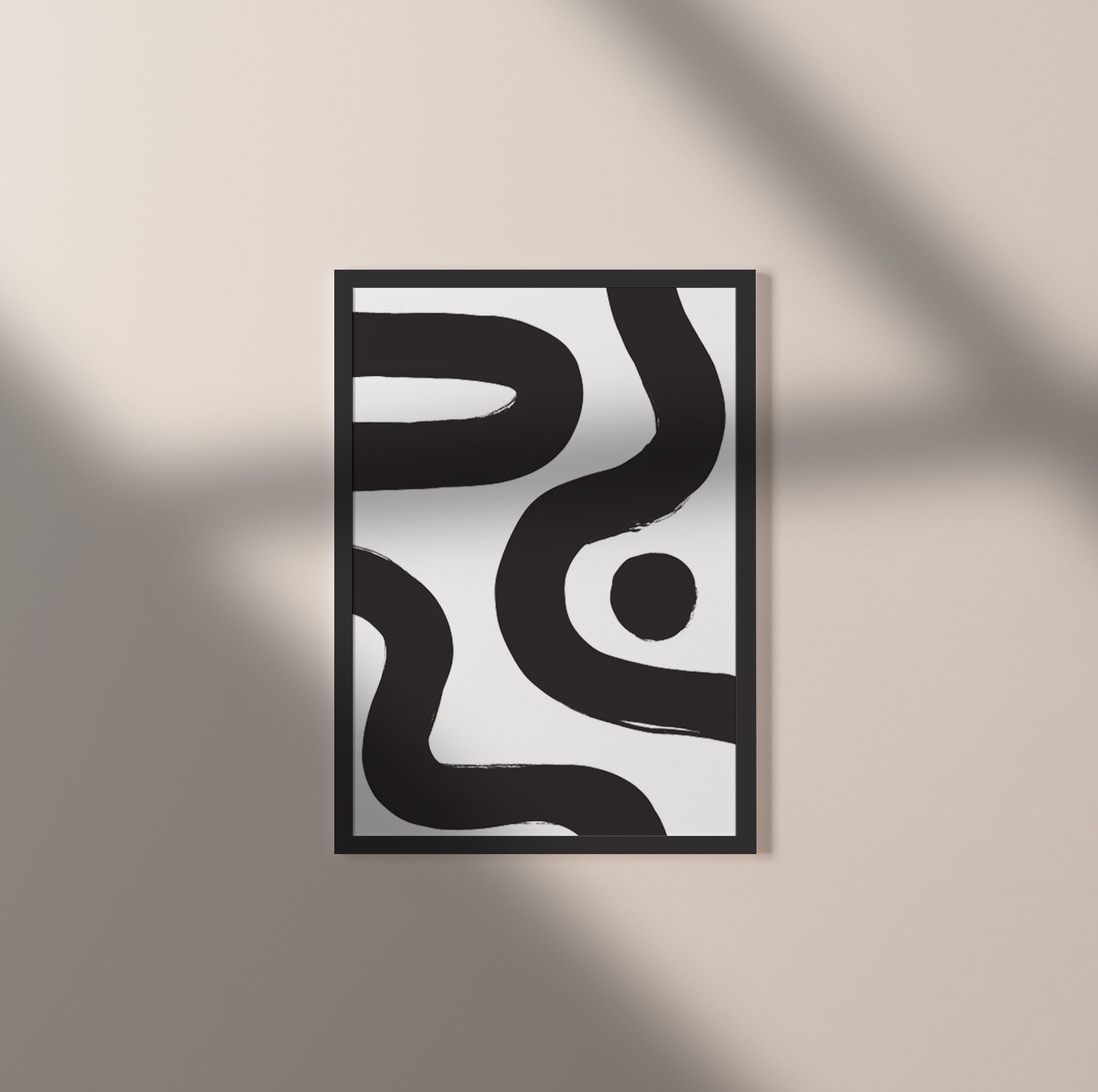 Ebb & Line I – luxury modern abstract art print in black and white with black wood frame. Shown as an individual print on a black frame against a light beige wall with shadows cast across it.